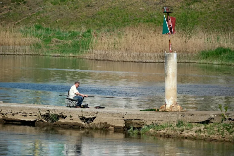 spring angler fishing river — photo from Pexels